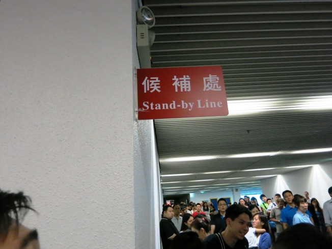 The long line where people can stand by and wait for a chance to go to Hong Kong earlier than your own schedule